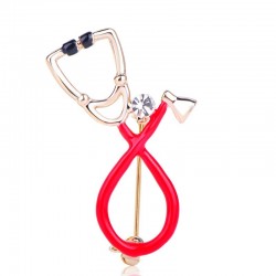 Stethoscope shaped brooch with crystal