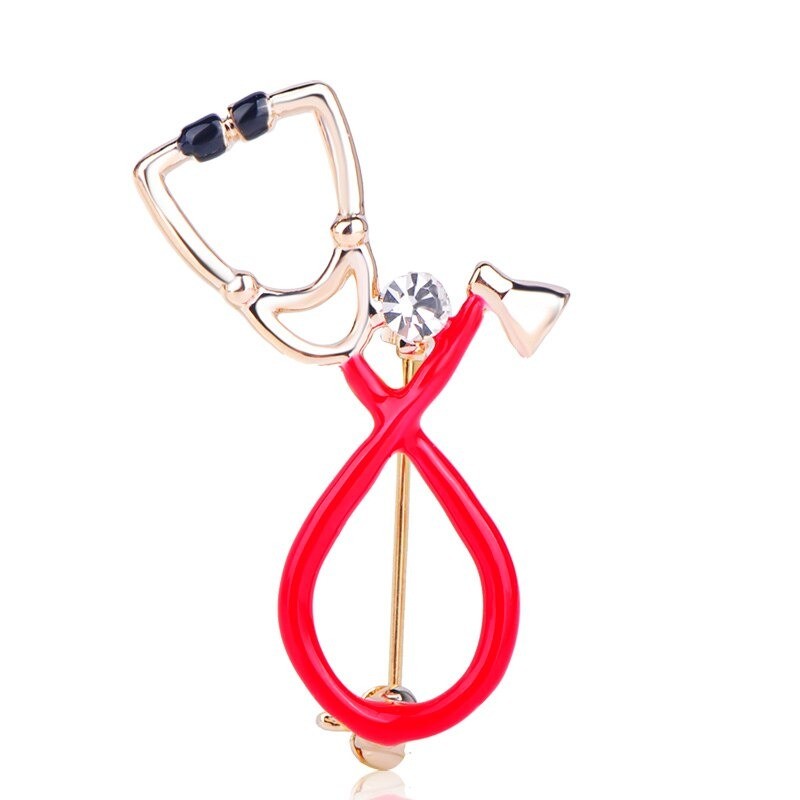 Stethoscope shaped brooch with crystalBrooches
