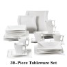 Elegant tableware - white porcelain dinner set - cups - saucers - platesCutlery