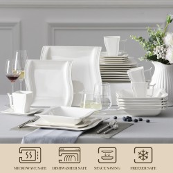 Elegant tableware - white porcelain dinner set - cups - saucers - platesCutlery