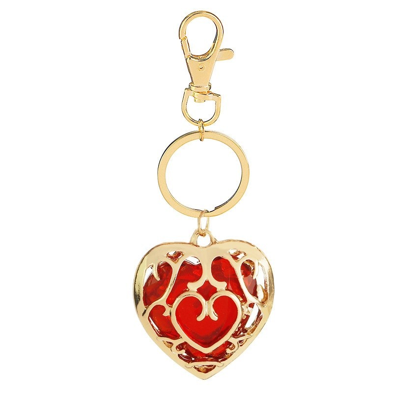 Crystal heart in golden cage - keychainKeyrings