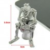 Squelette assis sur les toilettes - porte-clés en caoutchouc